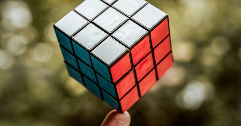 Rubix Cube balancing on a finger tip. Photo by Justus Menke.